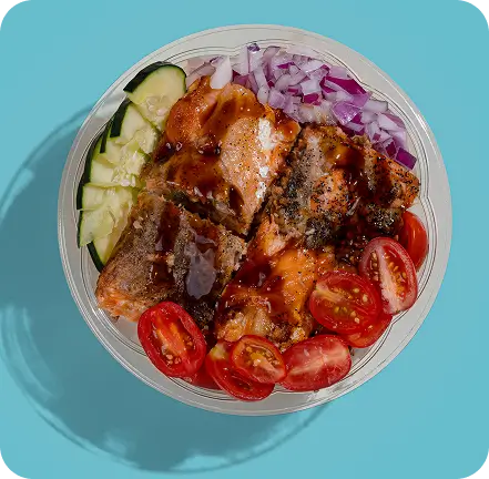 Korean BBQ Pork Bowl with fresh vegetables and house sauce, highlighting bold flavors and savory taste fusion.