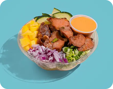 Fresh poke bowl with salmon, mango, onions, and sauce; customizable meal option in Long Island City.