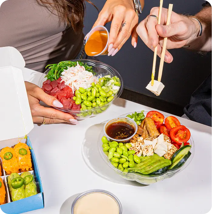 Salmon Skin Salad Poke Bowl with fresh ingredients and ponzu sauce at Upper East Side eatery.
