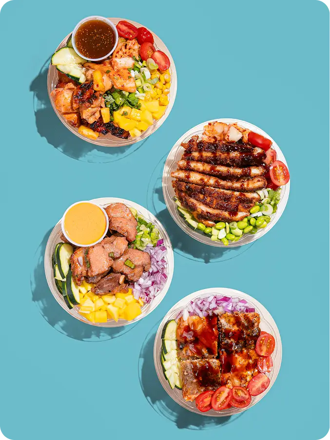 Colorful poke bowls with fresh ingredients like mango, edamame, and salmon from Poke Bowl NY's recommended menu options.