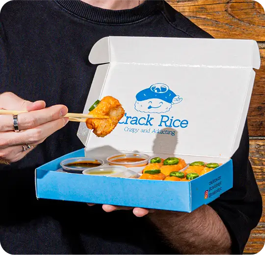 Succulent poke bowl from Crack Rice with dipping sauces, perfect for Theater District dining or catering events.