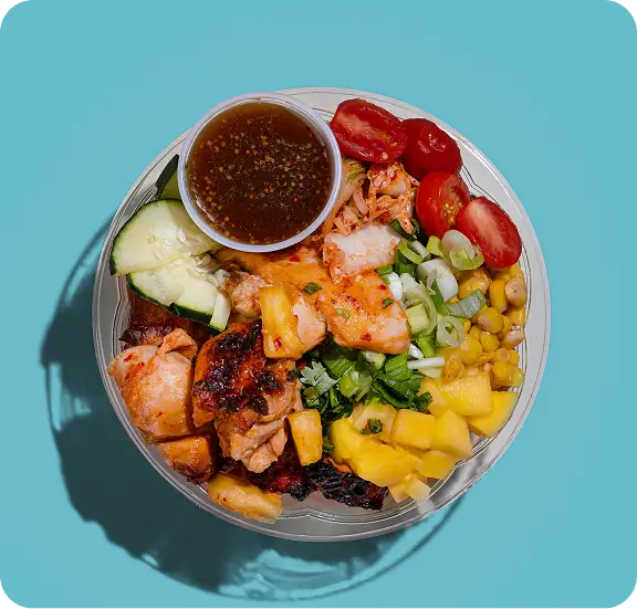 Delicious Poke Bowl with fresh vegetables and protein, topped with sauce, perfect for a nutritious meal.